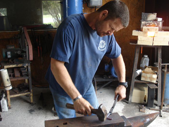 John Horrigan at the forge making another Elite Knife