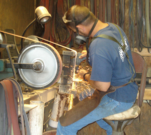 John Horrigan at the grinding wheel