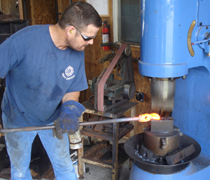 John Horrigan working at the trip hammer