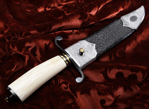 Close view of Elite Knives Ivory handle Bowie with laminated blade